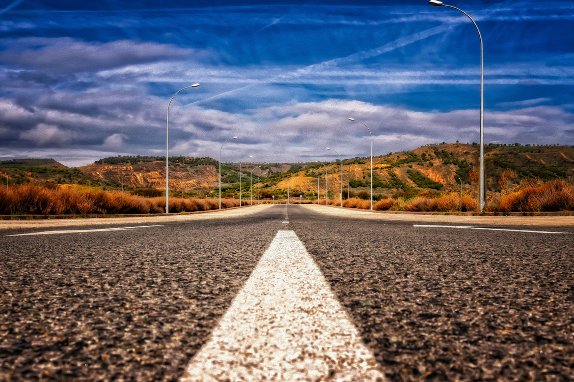Long Asphalt Road Leading Someone Far